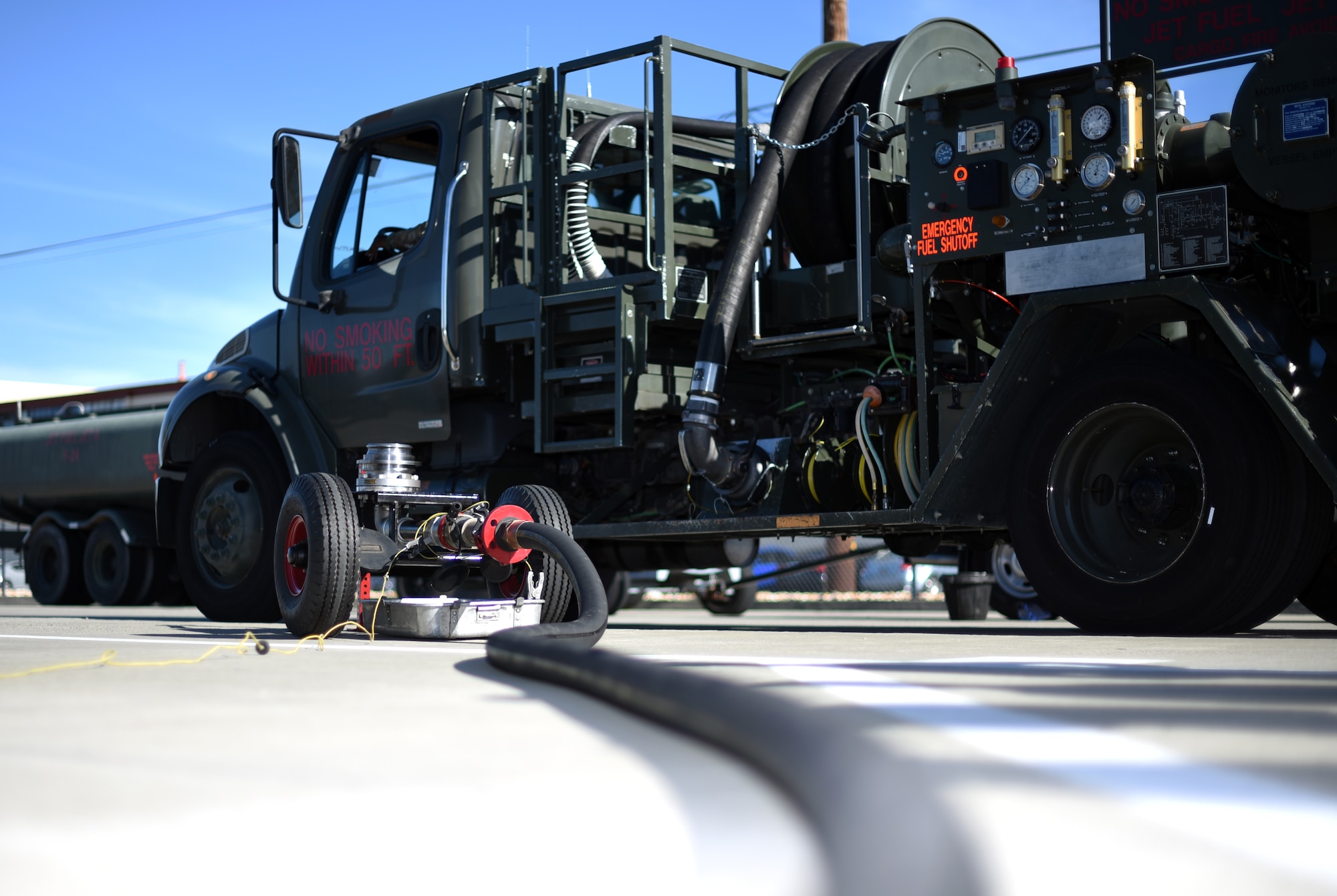 A prototype mobile fuel pressurizer sits ready for use beside a 60th Logistics Readiness Squadron fuel truck July 10, 2019, at Travis Air Force Base, California. The prototype has been proven to cut man hours for the fuel pressurization process from two hours to 45 minutes and is the brainchild of U.S. Air Force Senior Airman Tanner O’Laughlin, 60th LRS fuels distribution operator. (U.S. Air Force photo by Senior Airman Christian Conrad)