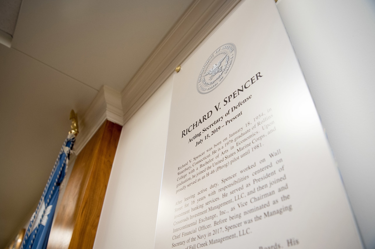 Acting Defense Secretary Richard V. Spencer's biography is displayed.