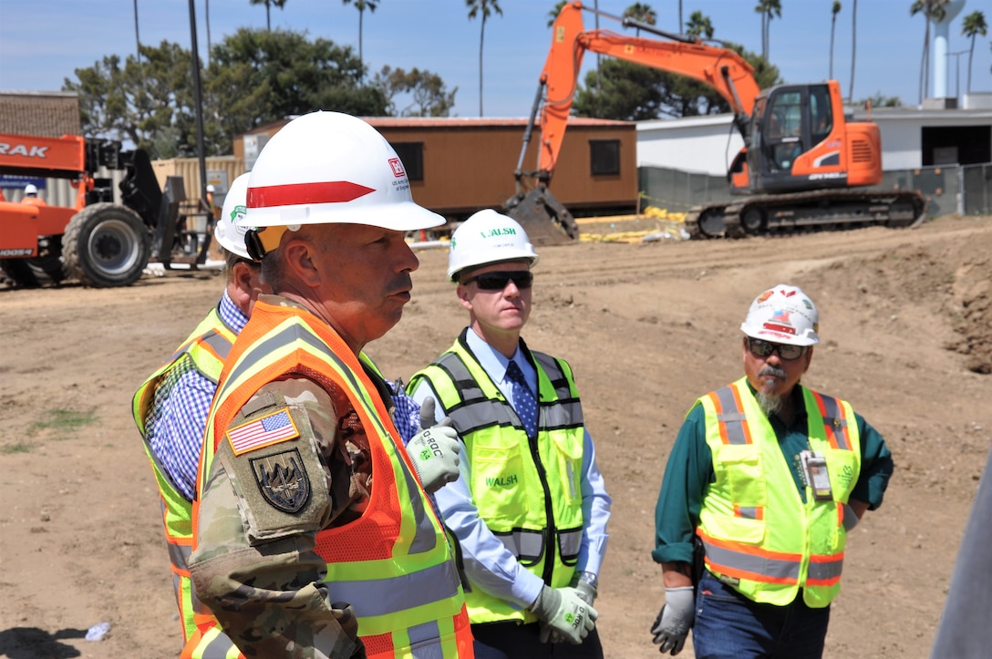 Lt. Gen. Todd T. Semonite, U.S. Army Corps of Engineers commanding general, foreground, receives an update during a site visit to the Corps’ Long Beach Veterans Affairs Healthcare System project from the Corps’ contractor, Walsh Construction, during a July 9 visit to the Long Beach VA Healthcare System Medical Center in Long Beach, California. The Corps is constructing the five-phase, $317-million-project, which includes a mental health in-patient/out-patient facility, community living center, parking structure, combined heat-and-power generation plant and demolition of the existing mental health and community living center buildings.