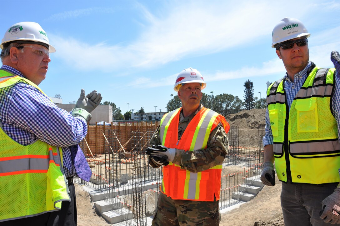 Lt. Gen. Todd T. Semonite, U.S. Army Corps of Engineers commanding general, center, receives an update about the Corps’ Long Beach Veterans Affairs Healthcare System project from the Corps’ contractor, Walsh Construction, during a July 9 visit to the medical center in Long Beach, California. The Corps is constructing a five-phase, $317-million-project at the Long Beach VA Healthcare System Medical Center, which includes a mental health in-patient/out-patient facility, community living center, parking structure, combined heat-and-power generation plant and demolition of the existing mental health and community living center buildings.