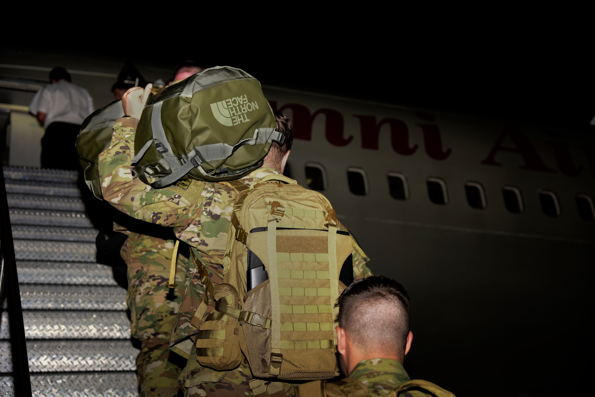 Airmen getting on a plane