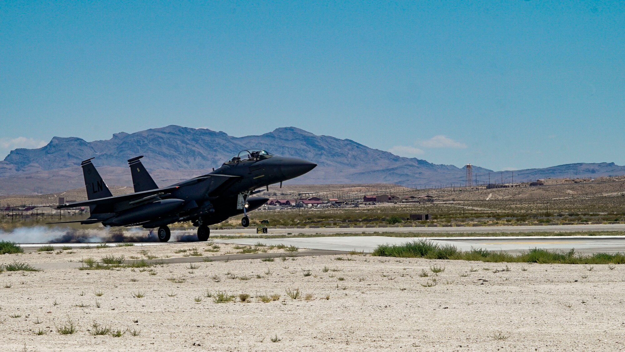 An F-15E Strike Eagle assigned to the 48th Fighter Wing at RAF Lakenheath lands at Nellis Air Force Base for Red Flag 19-3. Red Flag provides aircrews the experience of multiple, intensive air combat sorties in the safety of a training environment. (U.S. Air Force photo by Senior Airman Julian W. Kemper)