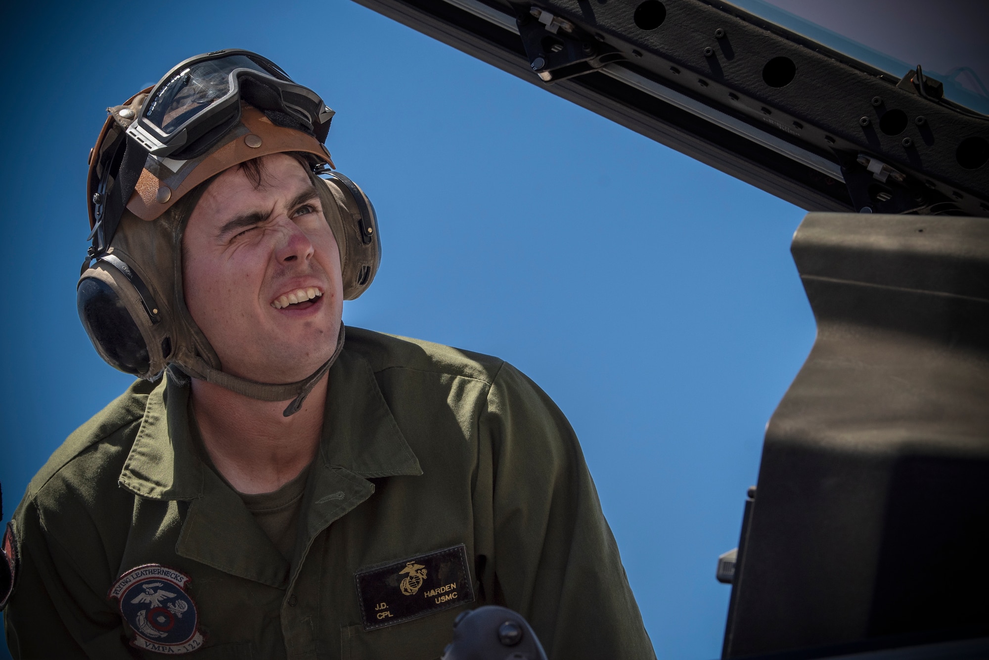 Airman looks into aircraft.