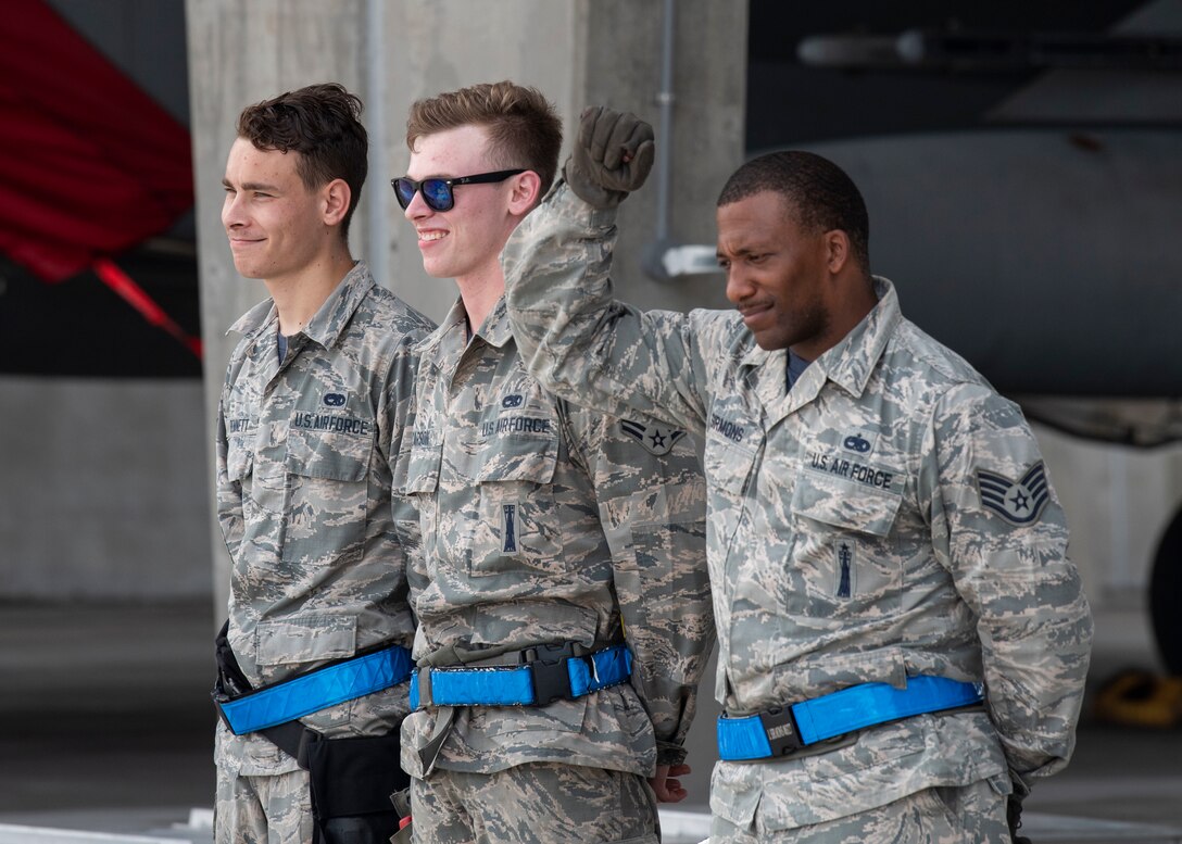 U.S. Air Force Airmen from the 67th Aircraft Maintenance Unit and the 44th Aircraft Maintanence Unit compete in the weapons load crew competition at Kadena Air Base, Japan, July 1, 2019. The weapons load competition is held between the 67th and 44th AMUs to determine the best weapons load crew members on Kadena.