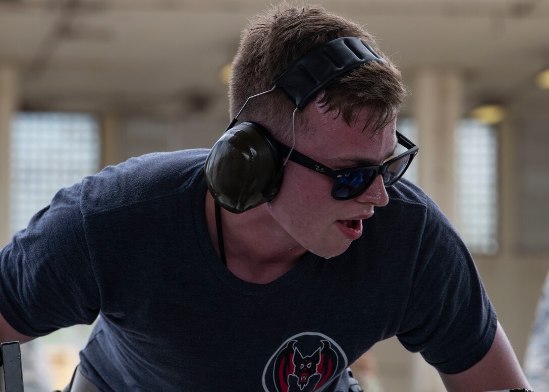 U.S. Air Force Airmen from the 67th Aircraft Maintenance Unit and the 44th Aircraft Maintanence Unit compete in the weapons load crew competition at Kadena Air Base, Japan, July 1, 2019. The weapons load competition is held between the 67th and 44th AMUs to determine the best weapons load crew members on Kadena.
