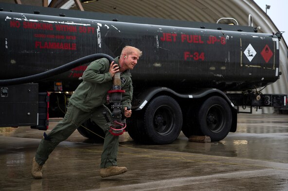 U.S. Air Force Maj. Michael Slotten, 421st Fighter Squadron F-35A Lightning II pilot, drags a fuel hose to an F-35A at Spangdahlem Air Base, Germany, July 11, 2019. Slotten was stationed at Spangdahlem from 2004 to 2006 as an Airman first class fuels distributor operator. He visited his old unit and became requalified to refuel aircraft to encourage Airmen who may want to follow in his footsteps. (U.S. Air Force photo by Airman 1st Class Valerie Seelye)