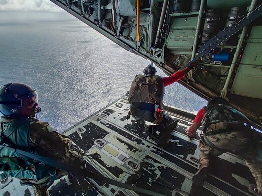 Pararescuemen from the 48th Rescue Squadron, Davis-Monthan Air Force Base, Arizona, prepare to parachute into the ocean from a HC-130J Combat King II aircraft from the 79th RQS to a Mexican fishing vessel as it sailed to Socorro Island, Mexico, July 10, 2019. The pararescuemen cared for two critically injured fishermen who were injured when a 25-ton crane fell on them. A Travis AFB, California, KC-10 Extender refueled the HC-130J over the Pacific Ocean enabling it to make it to the Tamara. (Courtesy photo)