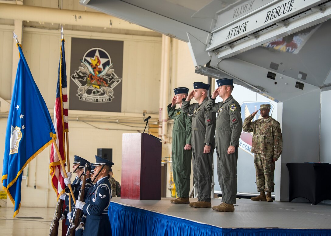 Airmen render salutes, for the playing of the national anthem during a change of command ceremony, July 14, 2019, at Moody Air Force Base, Ga. The ceremony is a military tradition that represents a formal transfer of a unit’s authority and responsibility from one commander to another. (U.S. Air Force photo by Airman 1st Class Eugene Oliver)
