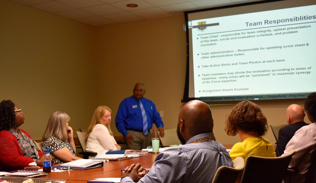 Air Force Services Center Lodging Management Specialist Daran Steele leads a discussion on Innkeeper Award evaluations in a final meeting before teams began their base visits. Seven installations -- three large and four small -- are in the running for this year's Innkeeper Awards. (U.S. Air Force photo by Armando Perez)