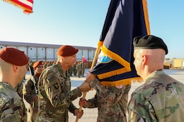 U.S. Army Command Sgt. Maj. Matthew S. Updike, Task Force Sinai’s (TFS) senior enlisted advisor, passes the TFS colors to Col. Mark P. Ott, the outgoing commander, during a change of command ceremony at South Camp, Egypt, July 15, 2019.