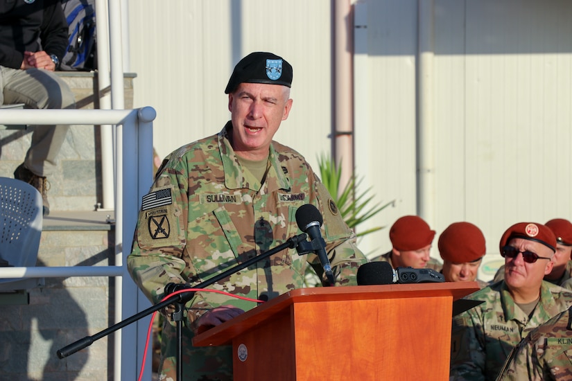 U.S. Army Maj. Gen. John P. Sullivan, commander of the 1st Theater Sustainment Command, addresses service members and civilians of the Multinational Force and Observers (MFO) during a change of command on the parade square at South Camp, Sinai, Egypt, July 15, 2019.