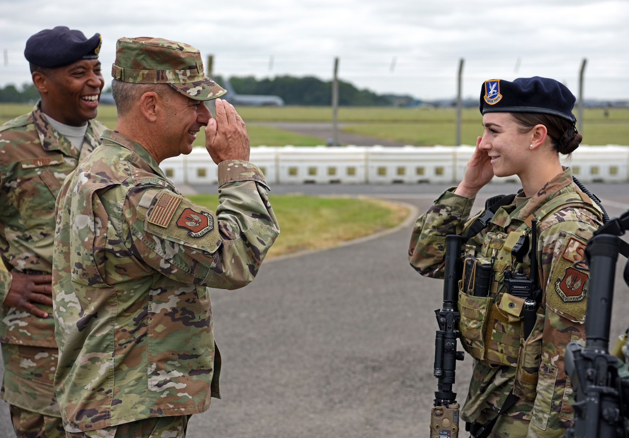 U.S. Air Force Gen. Jeff Harrigian, U.S. Air Forces in Europe – Air Forces Africa commander, salutes Senior Airman Sadie Gulley, 100th Security Forces Squadron member, after receiving a security briefing at RAF Mildenhall, England, July 15, 2019. During the visit, Harrigian discussed how crucial RAF Mildenhall is to our allies all over the region. (U.S. Air Force photo by Airman 1st Class Brandon Esau)