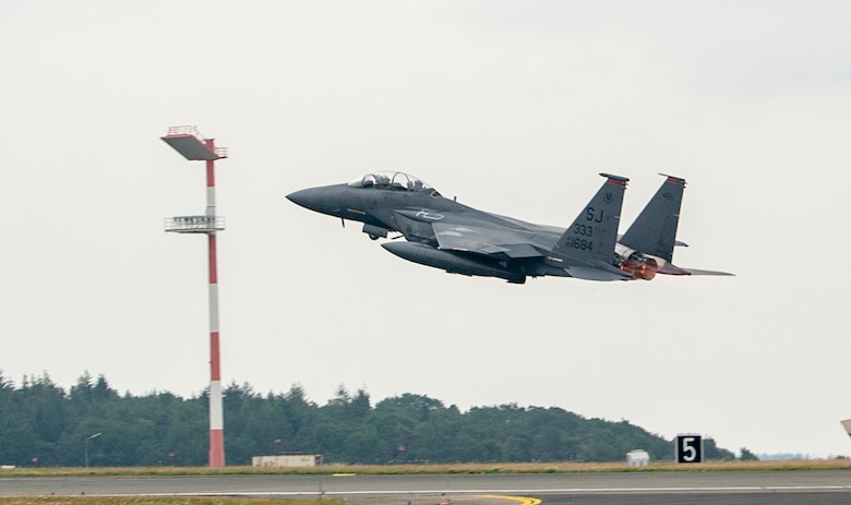 A U.S. Air Force F-15E Strike Eagle, assigned to the 4th Fighter Wing, Seymour Johnson Air Force Base, North Carolina, takes off at Spangdahlem Air Base, Germany, July 16, 2019, during Operation Rapid Forge. Rapid Forge aircraft are forward deploying to bases in the territory of NATO allies in order to enhance readiness and improve interoperability. The goal of the operation is to enhance readiness in coordination with U.S. allies and partners in Europe. (U.S. Air Force photo by Airman 1st Class Kyle Cope)
