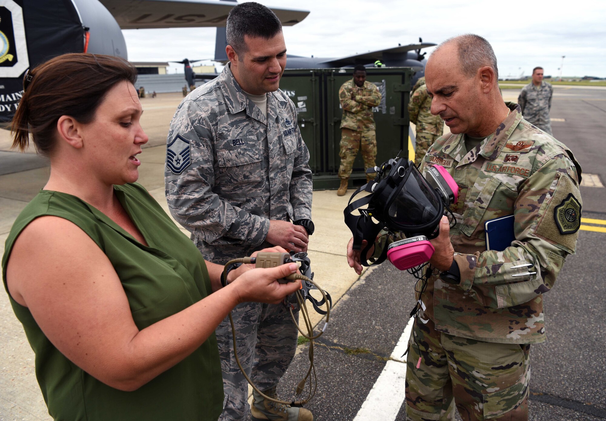 U.S. Air Force Gen. Jeff Harrigian, U.S. Air Forces in Europe – Air Forces Africa commander, is shown an Integrated Communication Respirator by Master Sgt. William Bell, 100th Maintenance Squadron accessories flight chief, and Mia Tobitt, 100th MXS Continuous Process Improvement manager, during a visit to RAF Mildenhall, England, July 15, 2019. During the visit, Harrigian stressed the importance of strengthening partnerships through various exercises and a shared, common goal. (U.S. Air Force photo by Airman 1st Class Brandon Esau)