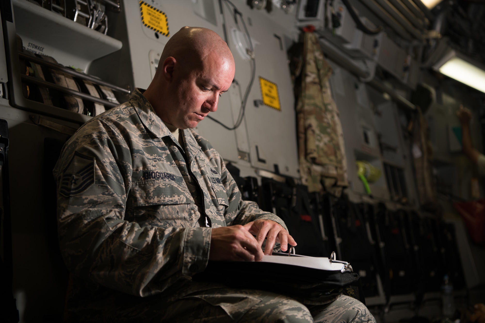 Master Sgt. Daniel Dioguardi, 736th Aerial Maintenance Squadron production superintendent, signs exceptional release forms on a C-17 Globemaster III May 20, 2019, at Dover Air Force Base, Del. All maintenance forms must be meticulously reviewed and signed before an aircraft is cleared for flight. (U.S. Air Force photo by Mauricio Campino)