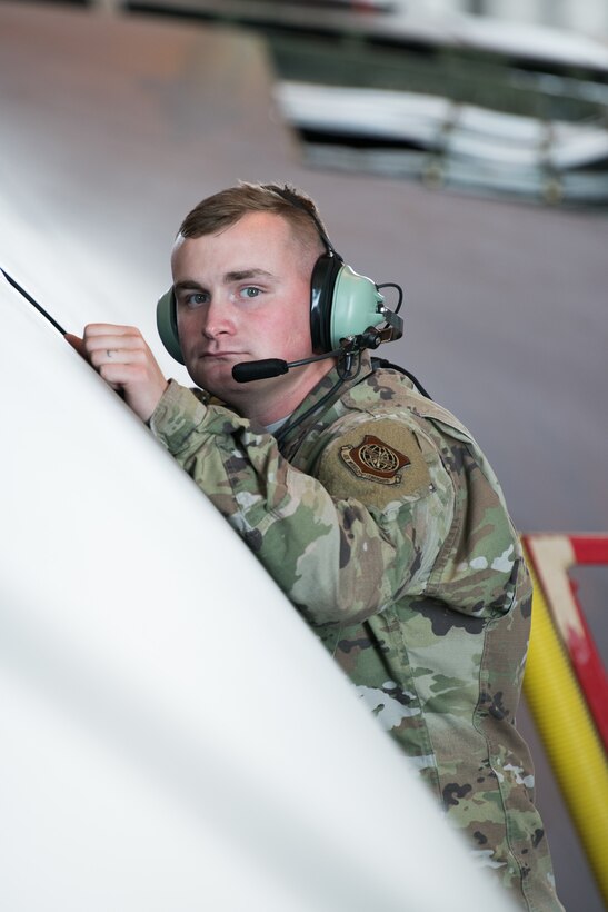 Staff Sgt. Austin Landrum, 436th Maintenance Squadron isochronal assistant floor chief, stands outside a C-5 Galaxy May 20, 2019, at isochronal maintenance dock at Dover Air Force Base, Del. While at the ISO dock, up to 100 airmen and civilians can be working on the aircraft at any one time. (U.S. Air Force photo by Mauricio Campino)