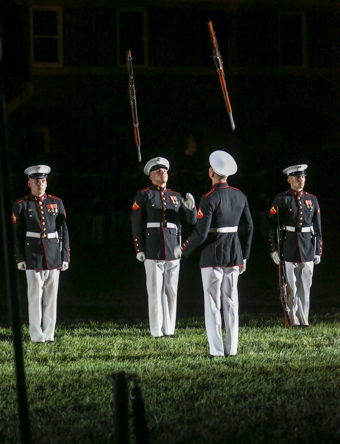 Marines with the U.S. Marine Corps Silent Drill Platoon execute their “rifle inspection” sequence during a Friday Evening Parade at Marine Barracks Washington D.C., July 12, 2019. Lieutenant Gen. John M. Jansen, deputy commandant, Programs and Resources, was the hosting official and His Excellency Shinsuke J. Sugiyama, Ambassador Extraordinary and Plenipotentiary to the United States from Japan and Minister Patrick Chuasoto, Deputy Chief of Mission from the United Kingdom of the Philippines to the United States were the guests of honor for the evening.
