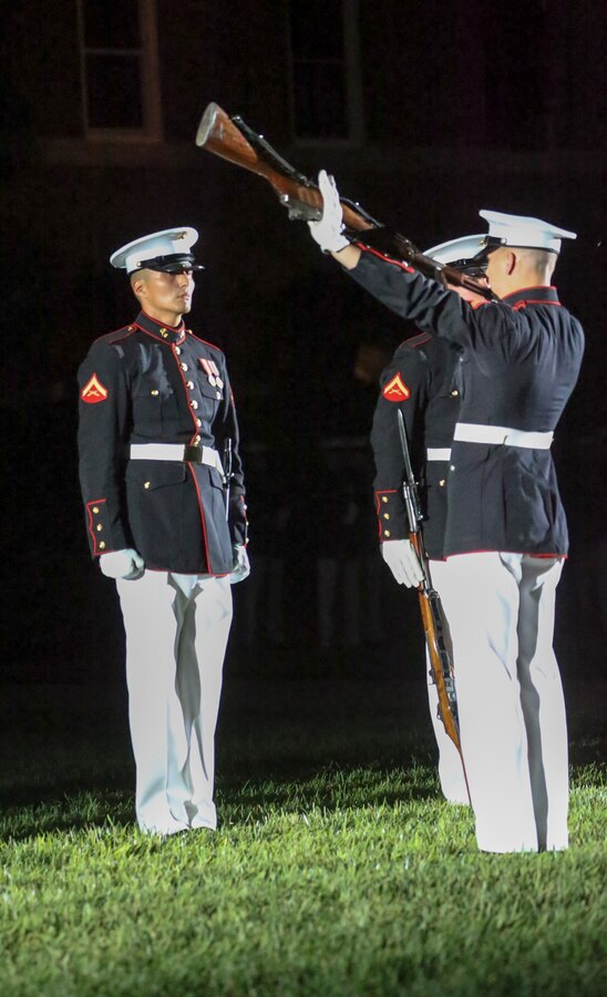 Marines with the U.S. Marine Corps Silent Drill Platoon execute their “long line” sequence during a Friday Evening Parade at Marine Barracks Washington D.C., July 12, 2019. Lieutenant Gen. John M. Jansen, deputy commandant, Programs and Resources, was the hosting official and His Excellency Shinsuke J. Sugiyama, Ambassador Extraordinary and Plenipotentiary to the United States from Japan and Minister Patrick Chuasoto, Deputy Chief of Mission from the United Kingdom of the Philippines to the United States were the guests of honor for the evening.