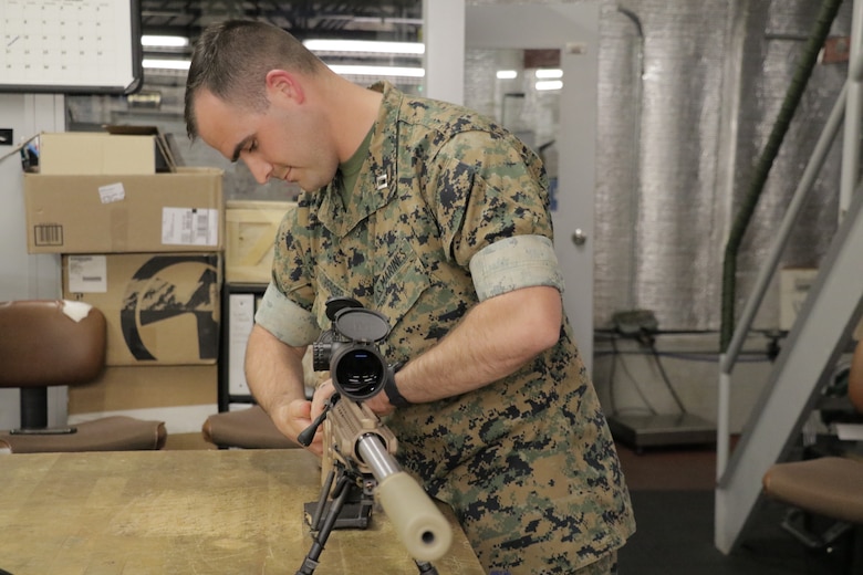Capt. Nick Berger, a project officer in Marine Corps Systems Command’s Infantry Weapons, demonstrates the MK13 Mod 7 July 1, aboard Marine Corps Base Quantico, Virginia. The system, which reached full operational capability in the second quarter of fiscal year 2019, shoots a more accurate bullet at greater distances than the legacy sniper rifle. Marines will primarily use the MK13 during deployments, while the M40A6 legacy rifle will be used for sniper training. (U.S. Marine Corps photo by Matt Gonzales)