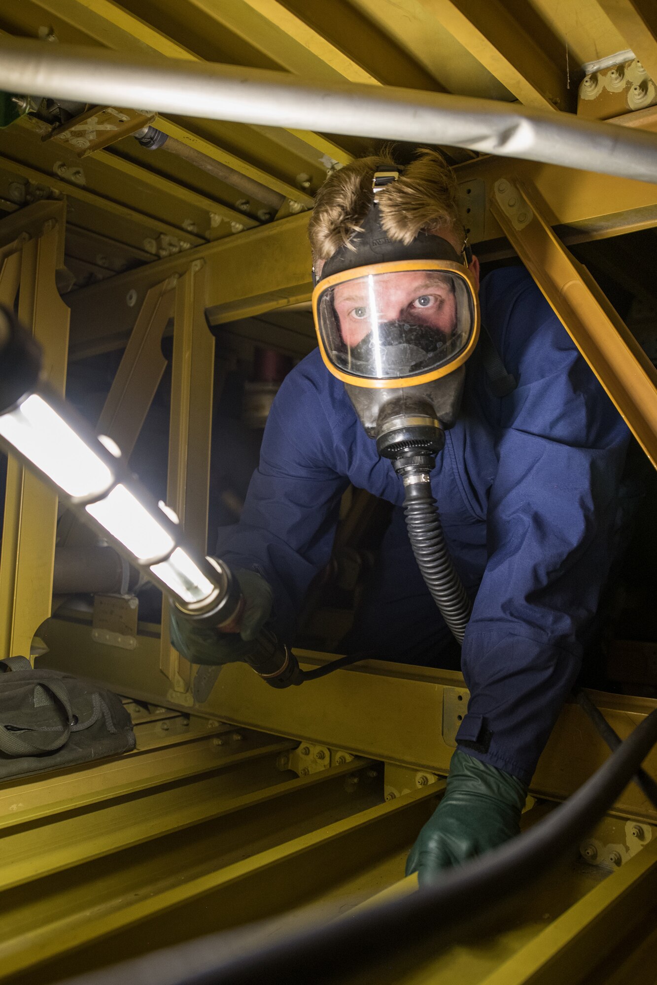 Senior Airman Caleb Osland, 436th Maintenance Squadron fuel systems repair journeyman, practices moving through an aircraft wing to remove and replace sealant from a tank boundary June 27, 2019, at Dover Air Force Base, Del. Airmen must traverse tightly enclosed spaces while wearing proper safety equipment.
(U.S. Air Force photo by Mauricio Campino)