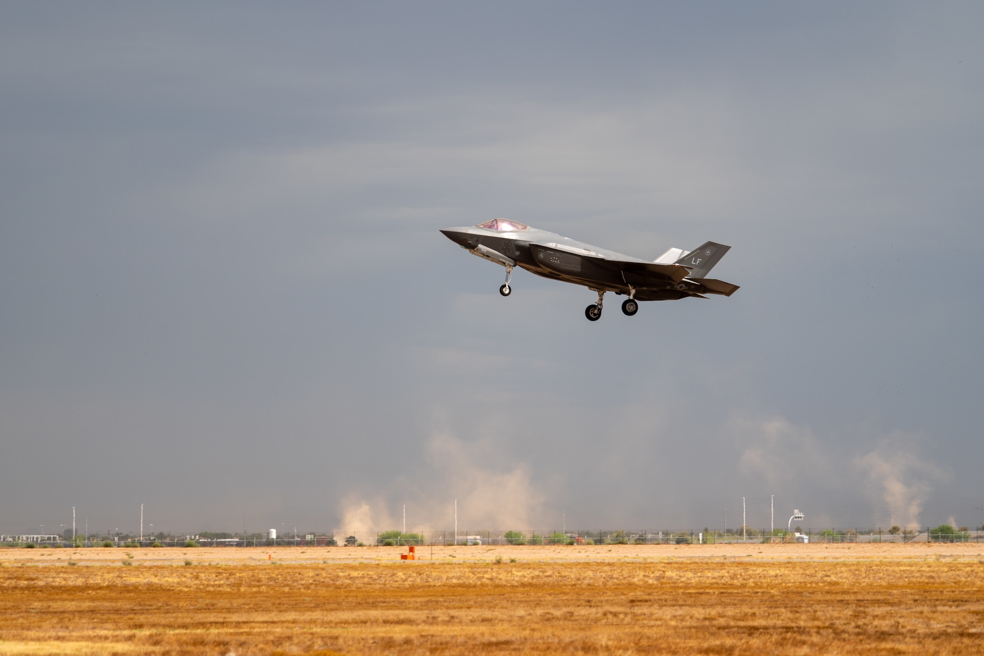 An F-35A Lightning II assigned to the 63rd Fighter Squadron lands during a storm July 12, 2019, at Luke Air Force Base, Ariz. More than 100 F-35 pilots graduate from Luke every year from three fighter squadrons. (U.S. Air Force photo by Airman 1st Class Aspen Reid)