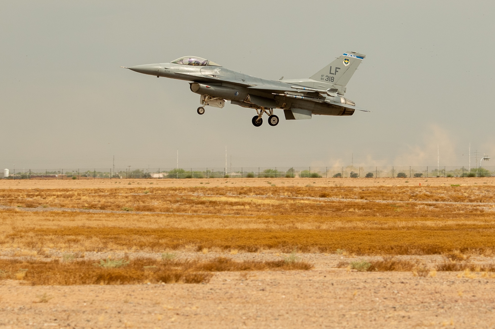 An F-16 Fighting Falcon, assigned to the 309th Fighter Squadron, lands July 12, 2019, at Luke Air Force Base, Ariz. The 309th FS was reactivated in 1994 and since then has continually produced fighter pilots and combat ready Airmen, flying more than 2,000 sorties a year. (U.S. Air Force photo by Airman 1st Class Aspen Reid)