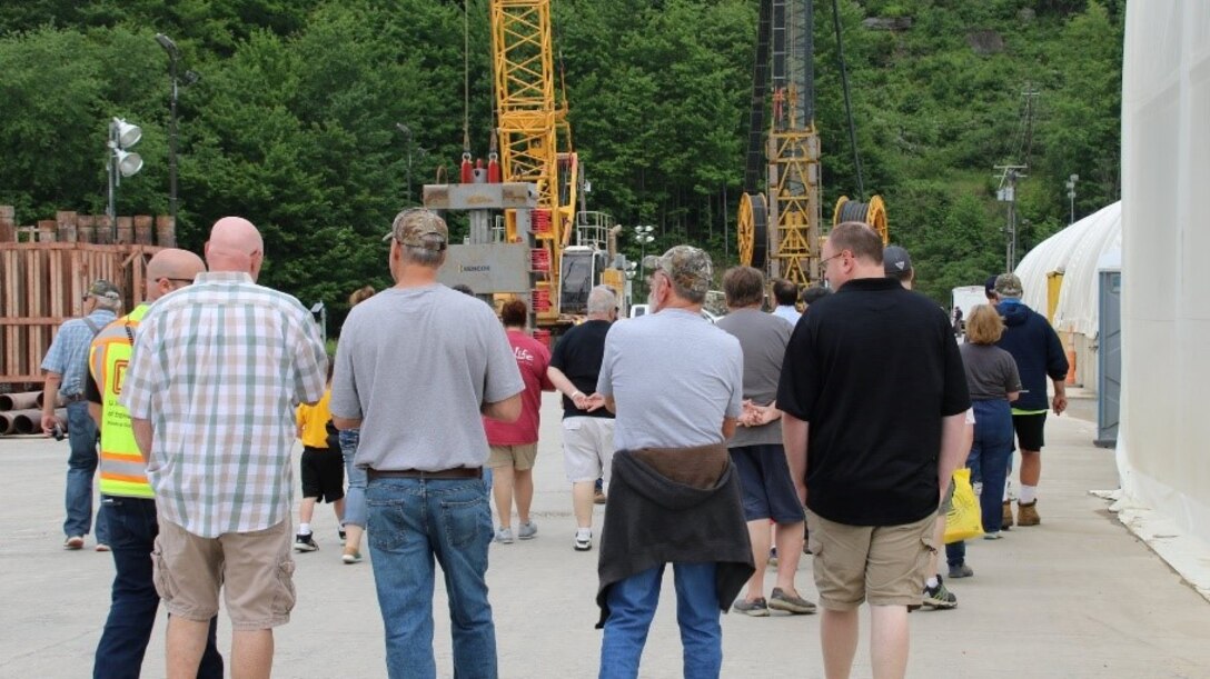 The threat of rain did not stop approximately 300 visitors from coming out to the East Branch Dam seepage cutoff wall construction site tour, June 1.