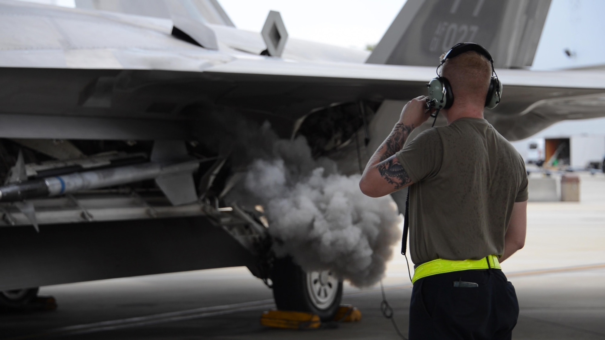 U.S. Air Force Senior Airman Jordan Arnold, 325th Aircraft Maintenance Squadron crew chief, from Tyndall Air Force Base, monitors an F-22 Raptor turning on at Eglin AFB, Florida, July 2, 2019.