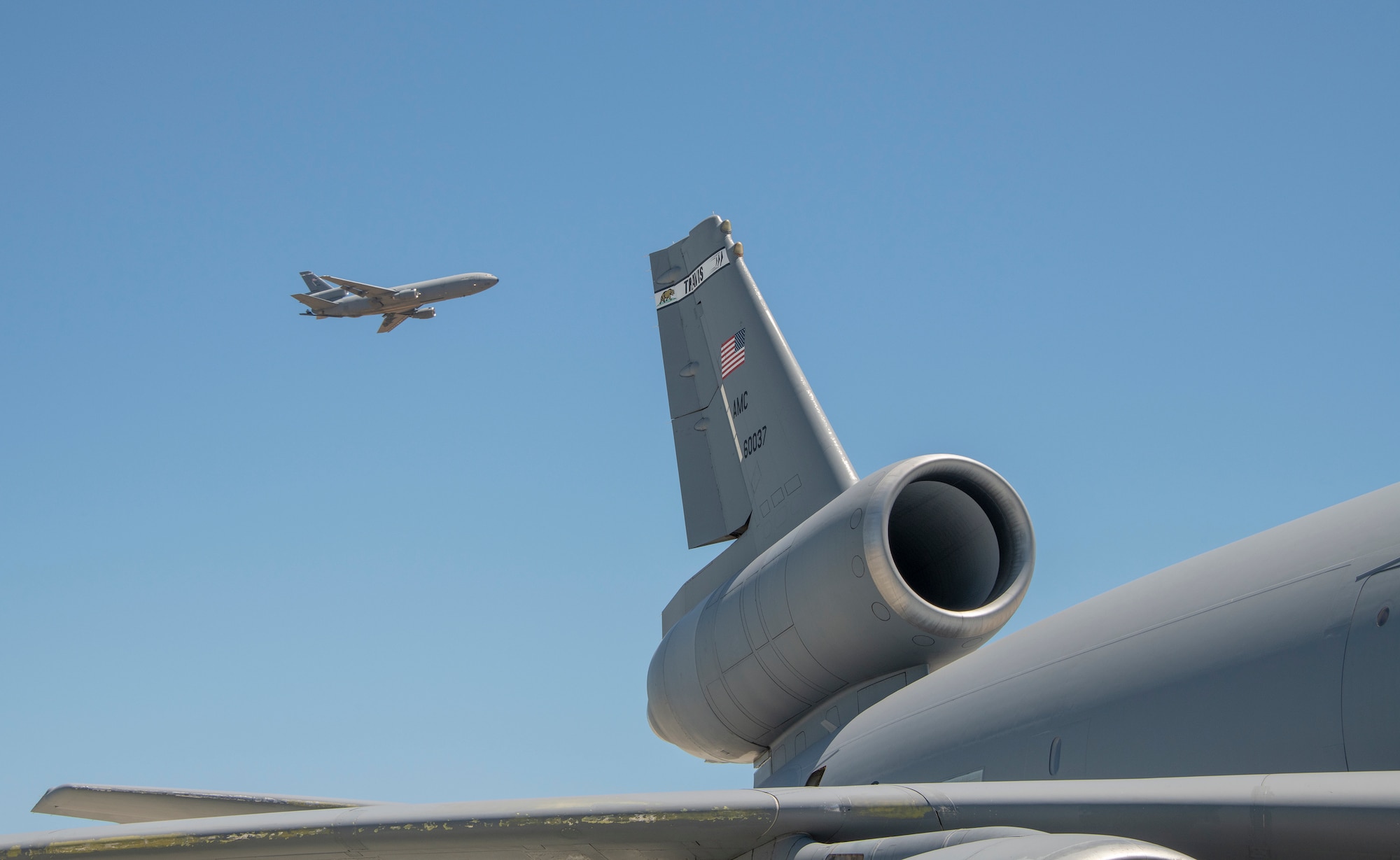 U.S. Air Force KC-10 Extender rests on the flight line July 11, 2019 at Travis Air Force Base, California. Although the KC-l0’s primary mission is aerial refueling, it can combine the tasks of a tanker and cargo aircraft by refueling fighters while simultaneously carrying support personnel and equipment. (U.S. Air Force photo by Heide Couch)