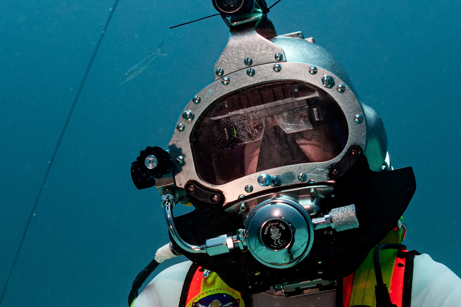 David Coan, extra vehicular activity lead for the National Aeronautics and Space Administration (NASA) Johnson Space Center dives at the Aquarius Reef Base underwater habitat.donning a Kirby Morgan-37 helmet equipped with the Divers Augmented Vision Device Generation 1.0 heads-up display during the 23rd NASA Extreme Environment Mission Operations in June 2019.