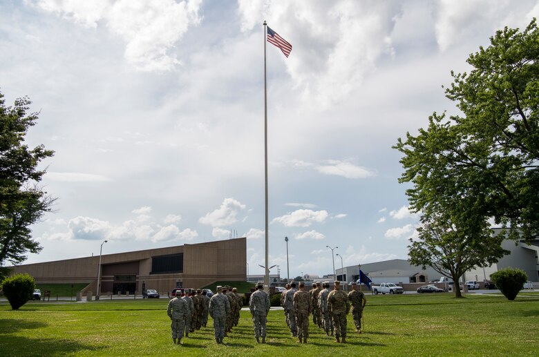 Members of the Air Force Mortuary Affairs Operations are positioned to conduct a retreat ceremony July 11, 2019, at Dover Air Force Base, Del. The ceremony signals the end of the official duty day and provides an opportunity to pay respect to the U.S. flag, soldiers, sailors, Marines and Airmen. (U.S. Air Force photo by Senior Airman Christopher Quail)