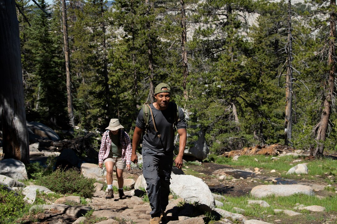 U.S. Air Force Tech. Sgt. Lavon Johnson, 6th Air Refueling Squadron independent duty medical technician, works his way up a hill July 13, 2019, at Yosemite National Park, California, during a 14.5- mile hike to Cloud’s Rest. Johnson joined 41 other Airmen for the hike which was held to enhance physical, mental and spiritual resiliency. (U.S. Air Fore photo by Tech. Sgt. James Hodgman)