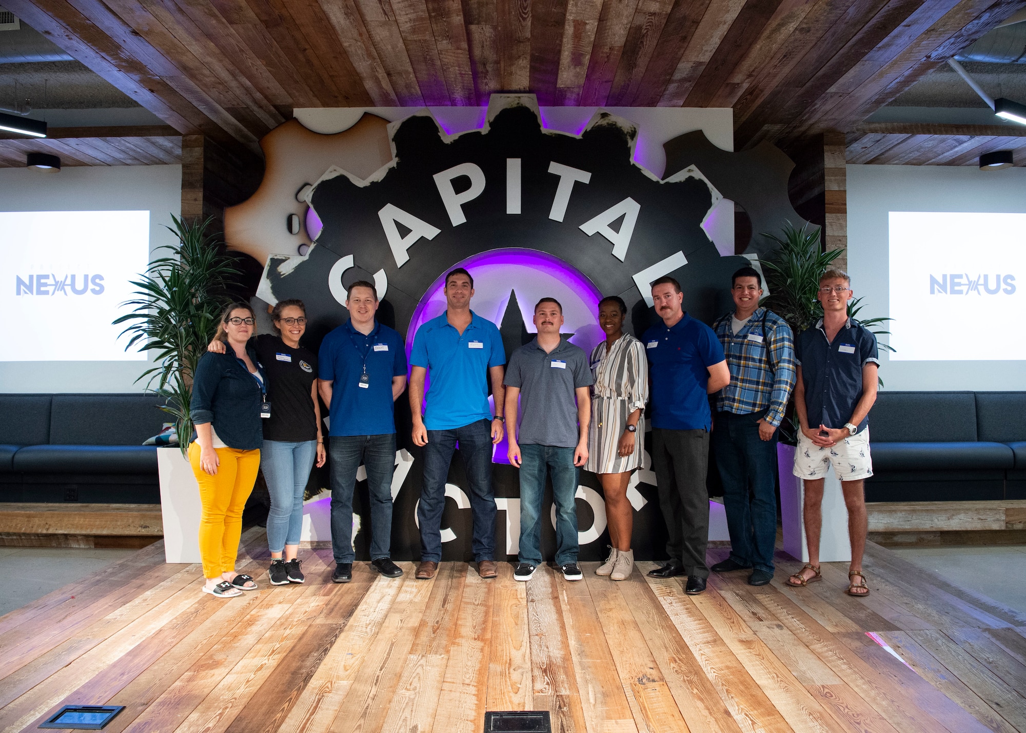 Cohort Three of Project NEXUS stand for a group photo with their vendor company, The Tech Academy, at the AFWERX Austin Hub July 8, 2019. NEXUS, a beta test aimed at learning the best ways to introduce more technologically ready Airmen into units, will consist of three cohorts of six Airmen, who come from various Air Force specialties and backgrounds. They will either specialize in data science, software development or application design. (U.S. Air Force photo by Staff Sgt. Jordyn Fetter)