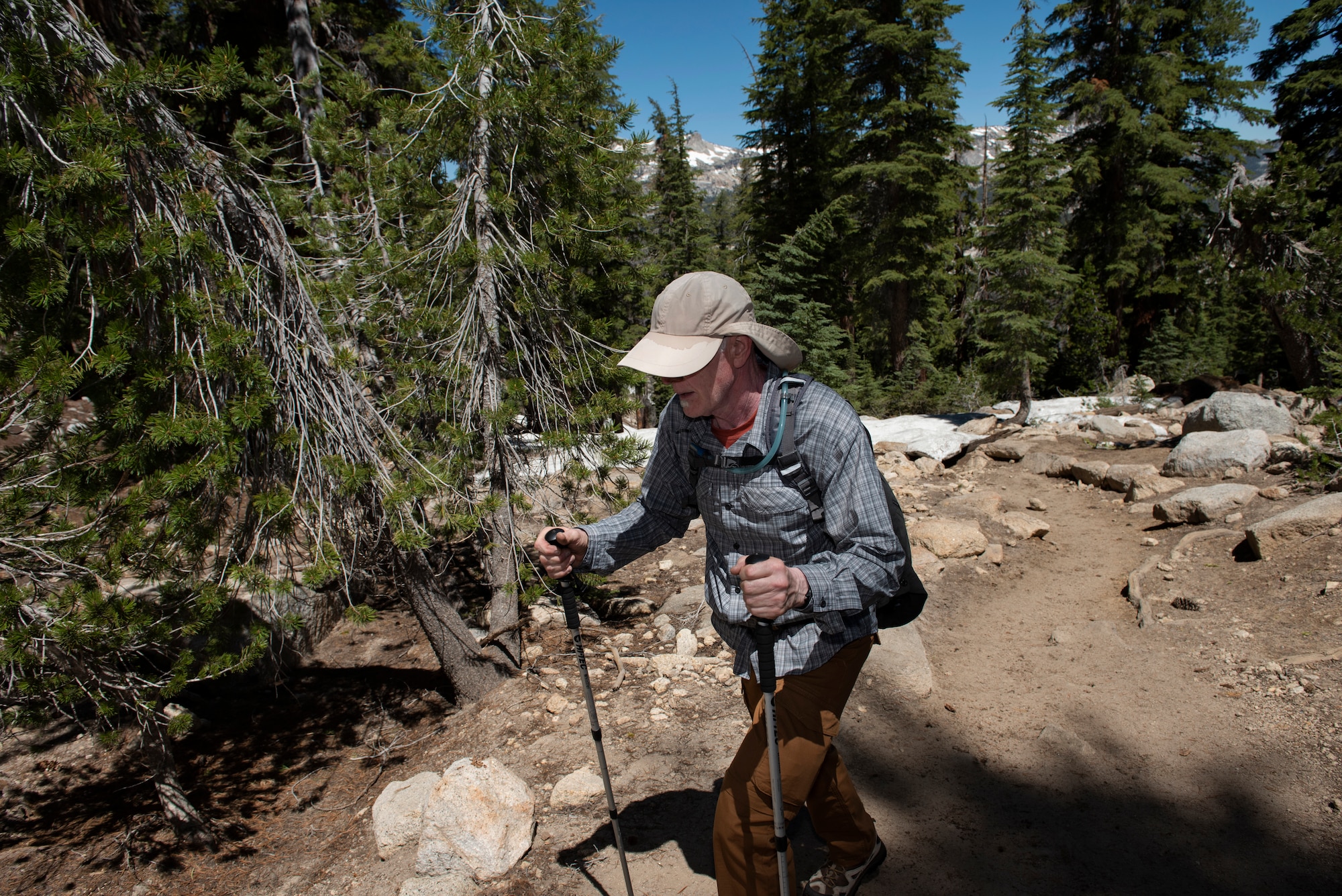 Retired U.S. Air Force Master Sgt. Terry Hendricksen, 60th Force Support Squadron outdoor recreation equipment repair technician, hikes toward lower elevation July 13, 2019, at Yosemite National Park, California. Hendricksen joined nearly four dozen Airmen from Travis Air Force Base, California, to hike to Cloud’s Rest covering 14.57 miles as they climbed to 9,926 feet above sea level. The hike was organized to enhance the Airmen’s physical, mental and spiritual resiliency. (U.S. Air Fore photo by Tech. Sgt. James Hodgman)