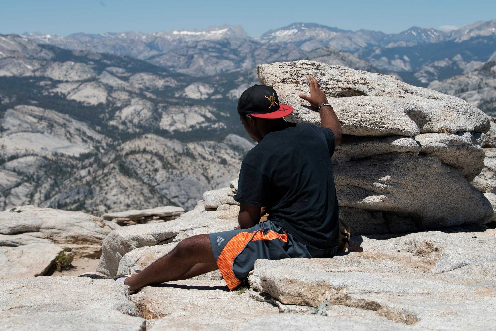 U.S. Air Force Capt. Ayodeji Alaketu, 60th Medical Operations Squadron family resident physician, enjoys the view from the summit of Cloud’s Rest July 13, 2019, at Yosemite National Park, California. Alaketu and 41 other Airmen from Travis Air Force Base, California, hiked to Cloud’s Rest covering 14.57 miles as they climbed to 9,926 feet above sea level. The hike was organized to enhance the Airmen’s physical, mental and spiritual resiliency. (U.S. Air Fore photo by Tech. Sgt. James Hodgman)