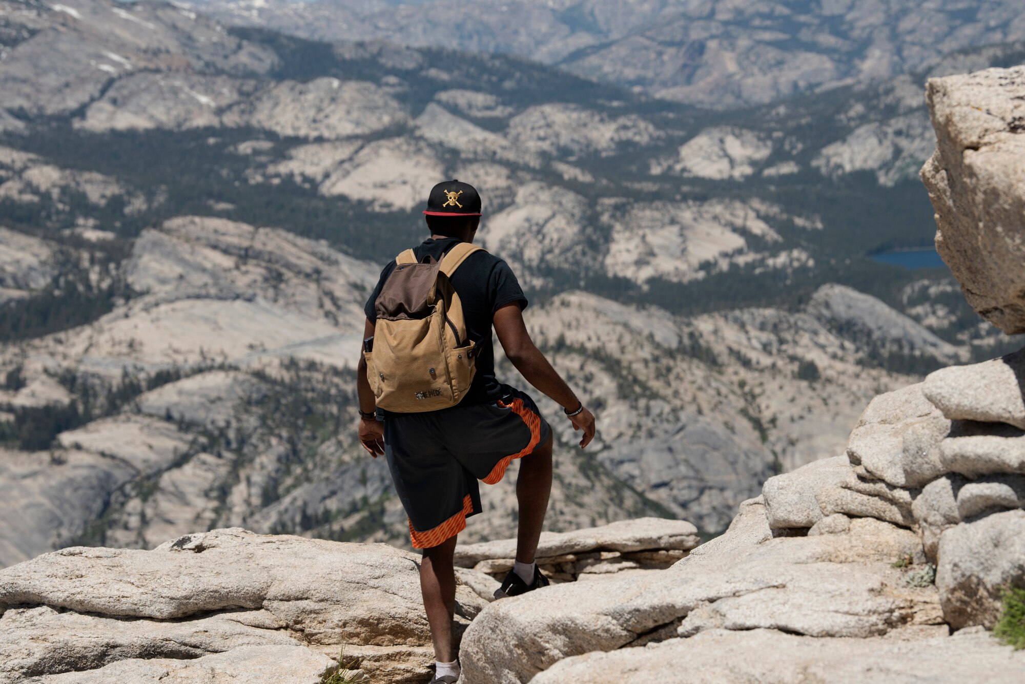 U.S. Air Force Capt. Ayodeji Alaketu, 60th Medical Operations Squadron family resident physician, prepares to hike down from the summit of Cloud’s Rest July 13, 2019, at Yosemite National Park, California. Alaketu and 41 other Airmen from Travis Air Force Base, California, hiked to Cloud’s Rest covering 14.57 miles as they climbed to 9,926 feet above sea level. The hike was organized to enhance the Airmen’s physical, mental and spiritual resiliency. (U.S. Air Fore photo by Tech. Sgt. James Hodgman)