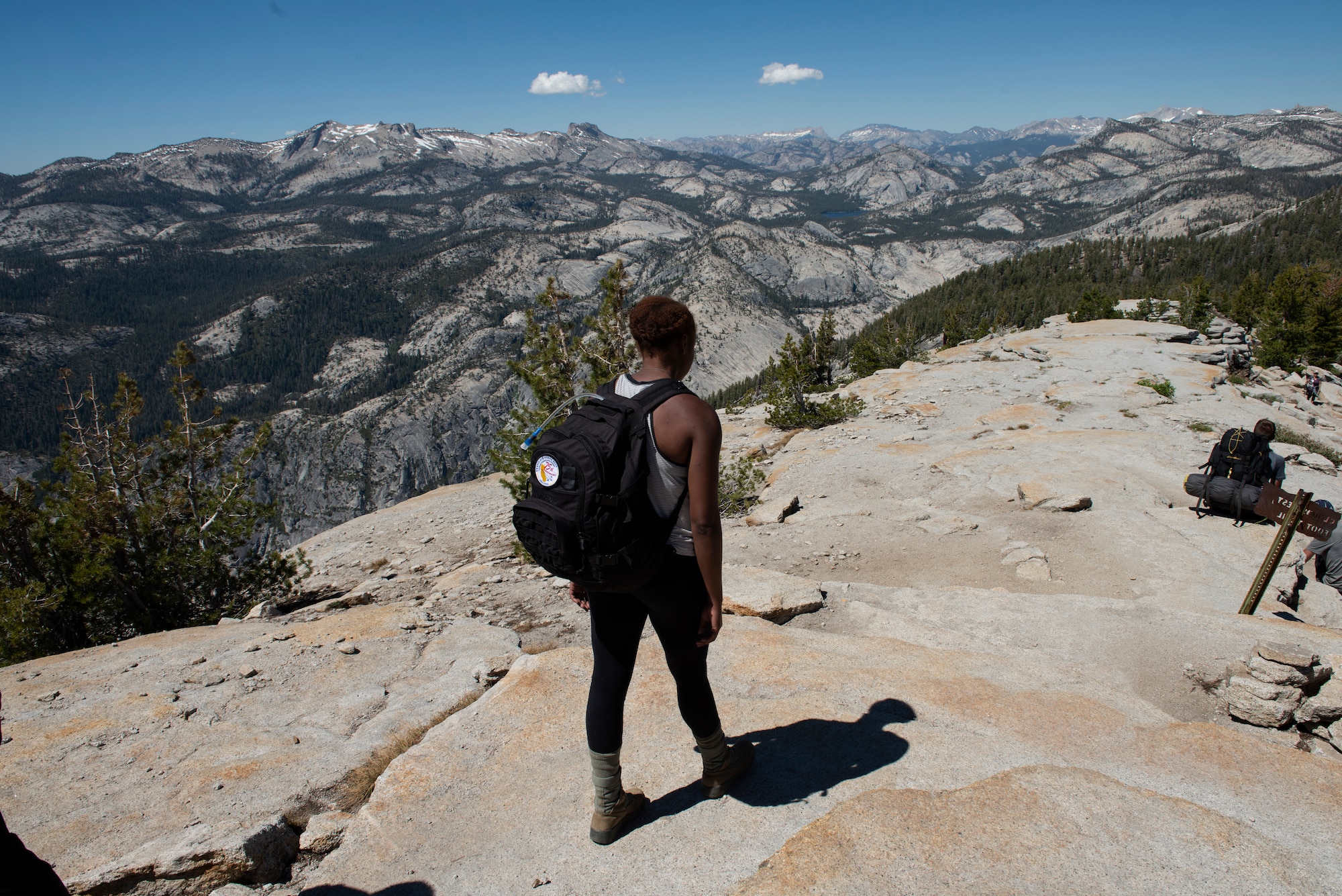 U.S. Air Force Senior Airman Lanisa Haynes, 60th Aerospace Medical Squadron medical technician, hikes down from the summit of Cloud’s Rest July 13, 2019, at Yosemite National Park, California. Haynes and 41 other Airmen from Travis Air Force Base, California, hiked to Cloud’s Rest covering 14.57 miles as they climbed to 9,926 feet above sea level. The hike was organized to enhance the Airmen’s physical, mental and spiritual resiliency. (U.S. Air Fore photo by Tech. Sgt. James Hodgman)