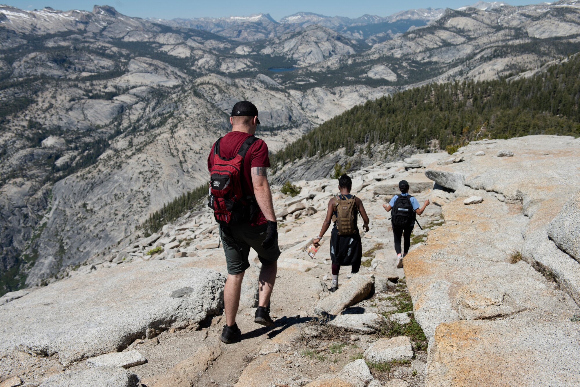 Airmen from Travis Air Force Base, California, work their way down the summit of Cloud’s Rest July 13, 2019, during a resilience hike at Yosemite National Park, California. The Airmen hiked to Cloud’s Rest covering 14.57 miles as they climbed to 9,926 feet above sea level. The hike was organized to enhance the Airmen’s physical, mental and spiritual resiliency. (U.S. Air Fore photo by Tech. Sgt. James Hodgman)