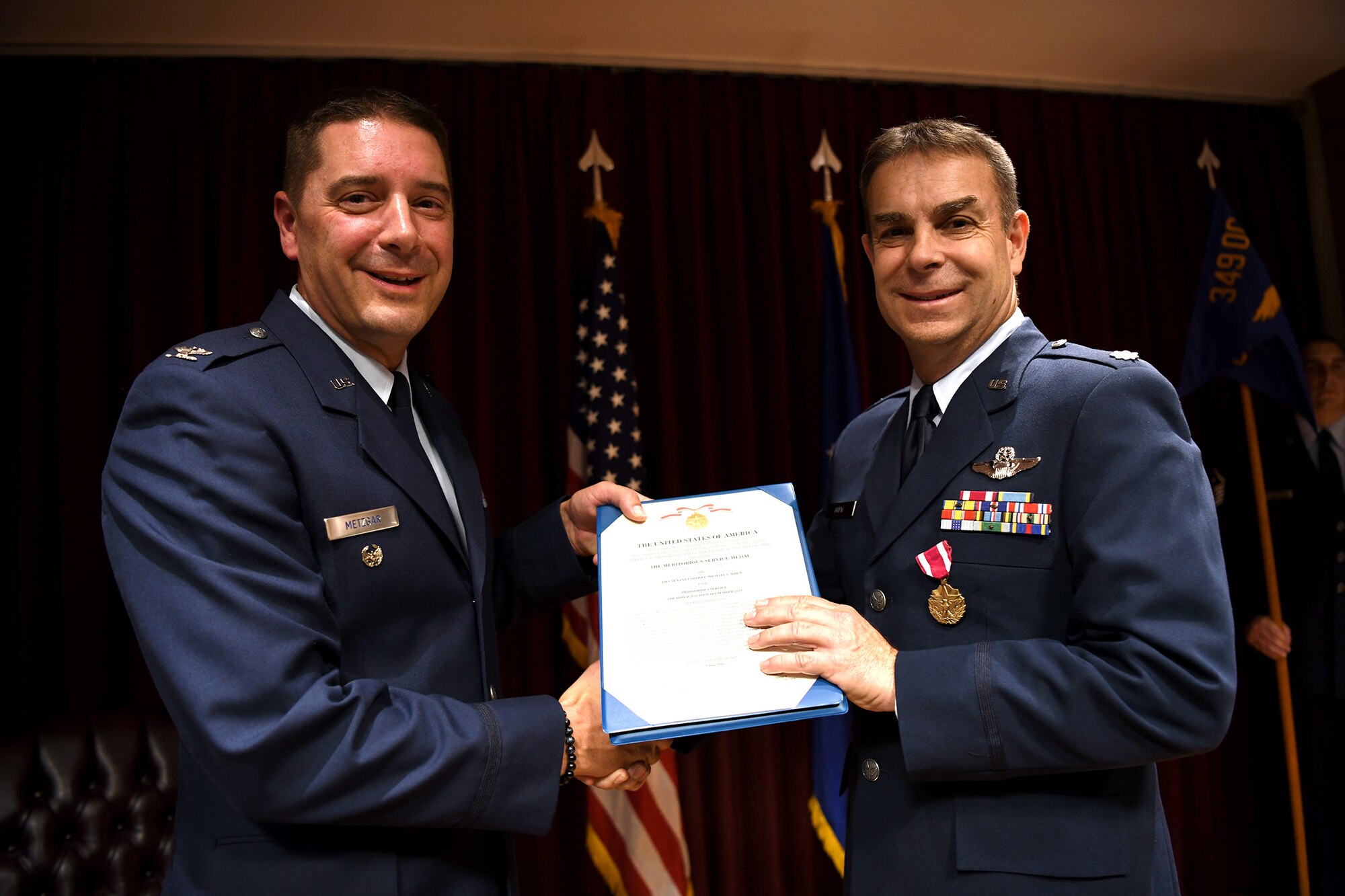Here at Travis Air Force Base, Calif., July 13, 2019, Lt. Col. Michael L. Drew passed command of the 349th OSS to Lt. Col. Andrew H. Black.