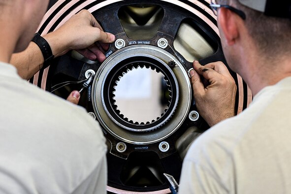 Senior Airman Daniel Phillis and Tech. Sgt. Daniel Slepsky, both aerospace propulsion technicians from the 910th Aircraft Maintenance Squadron, apply safety wire to a C-130H propeller assembly here July 15, 2019.