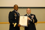 Army Brig. Gen. Gavin Lawrence, DLA Troop Support commander, left, poses with Army Lt. Col. Jimmy Baker, Medical’s Operational Customer Facing Division chief, right, during a retirement ceremony at DLA Troop Support July 11, 2019 in Philadelphia.