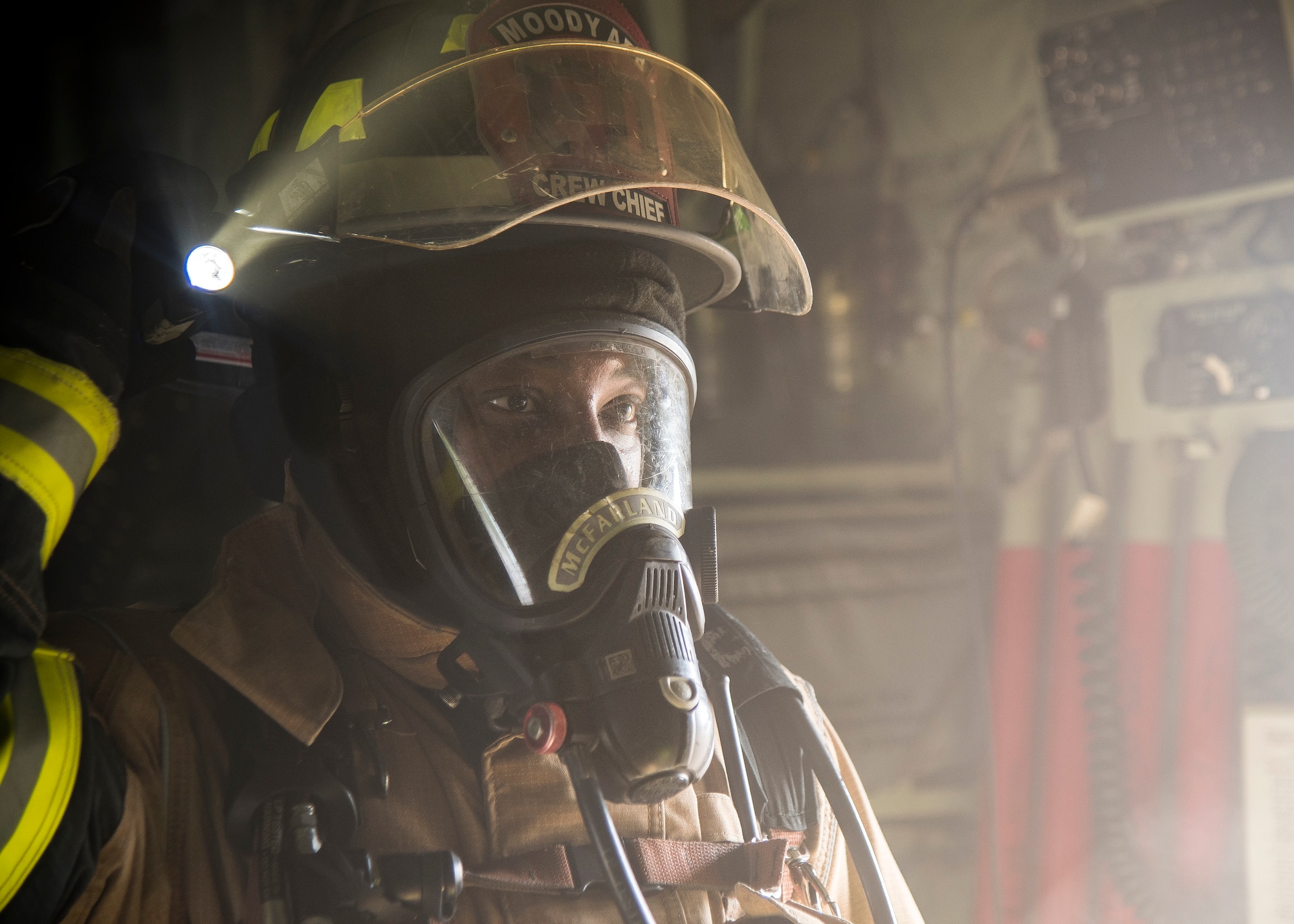 Staff Sgt. Tyler McFarland, 23d Civil Engineer Squadron (CES) firefighter crew chief, searches for personnel to rescue during HC-130J Combat King II egress training, July 11, 2019, at Moody Air Force Base, Ga. Firefighters conducted the training to evaluate their overall knowledge and proficiency of how to properly shut down and rescue personnel from a C-130 during an emergency situation. The training required the firefighters to properly enter and ventilate the aircraft while conducting swift rescue techniques to safely locate and remove passengers from the aircraft. (U.S. Air Force photo by Airman 1st Class Eugene Oliver)