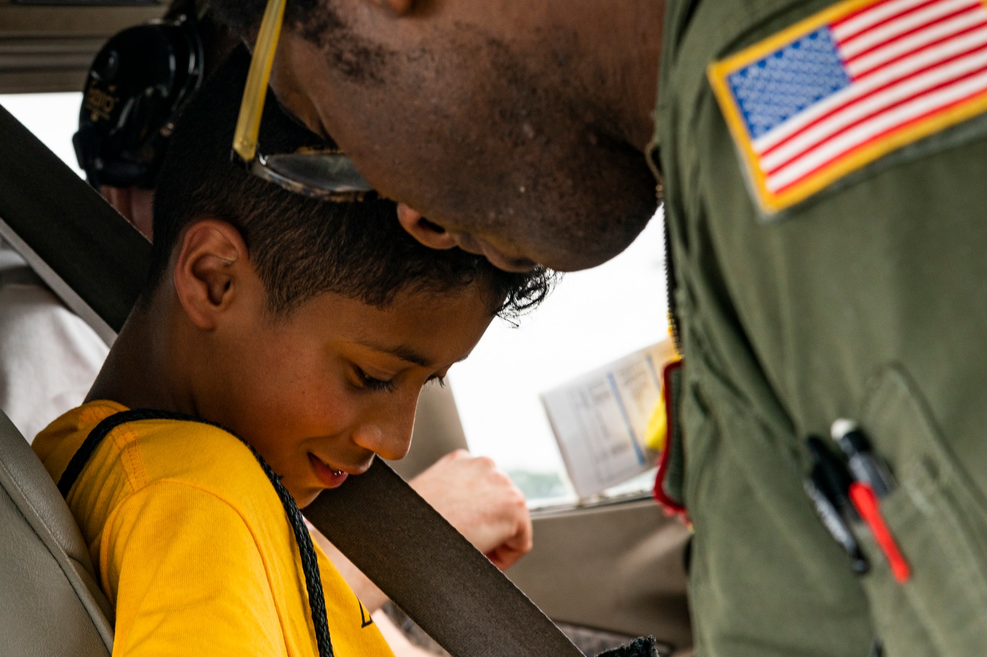 Capt. Wayne Walker, 164th Airlift Squadron pilot, straps a participant in for an introductory flight during the Eyes Above the Horizon diversity outreach program, July 13, 2019, in Valdosta, Ga. The Valdosta Regional Airport hosted the Legacy Flight Academy and over 60 youths ranging in age from 10-19 for a day of flight introduction and immersion into the legacy of the historic Tuskegee Airmen. The program is designed to remove barriers for underrepresented minorities and inspire an interest in aerospace careers. (U.S. Air Force photo by Airman 1st Class Hayden Legg)