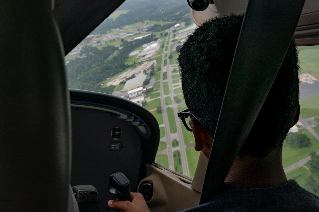 A participant pilots an aircraft during the Eyes Above the Horizon diversity outreach program, July 13, 2019, in Valdosta, Ga. The Valdosta Regional Airport hosted the Legacy Flight Academy and over 60 youths ranging in age from 10-19 for a day of flight introduction and immersion into the legacy of the historic Tuskegee Airmen. The program is designed to remove barriers for underrepresented minorities and inspire an interest in aerospace careers. (U.S. Air Force photo by Airman 1st Class Hayden Legg)
