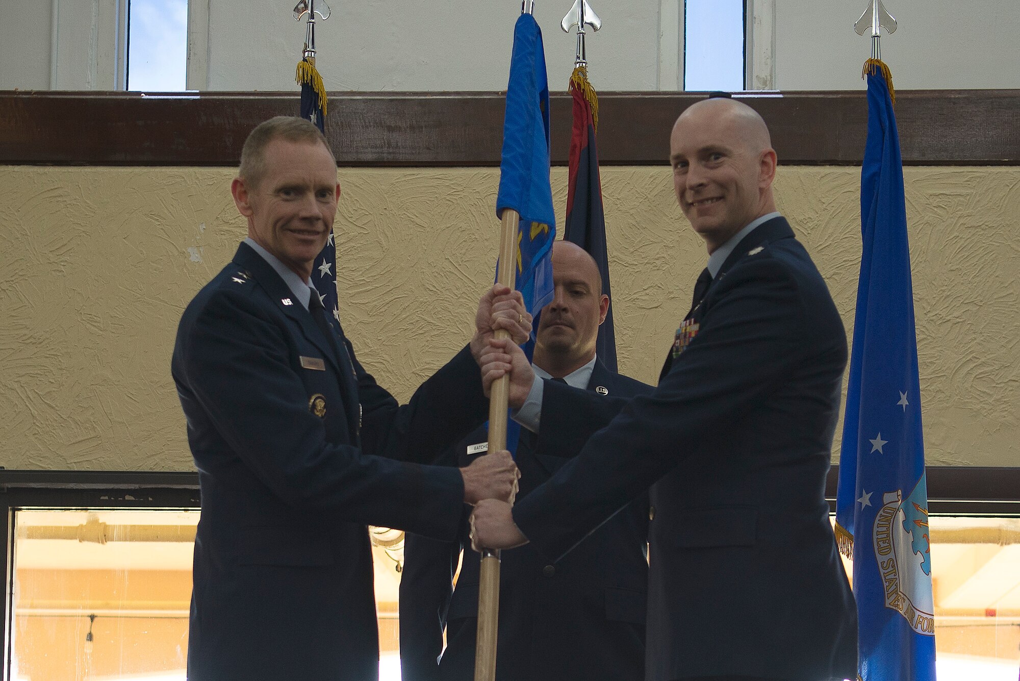 U.S. Air Force Lt. Col. Thomas Moncrief III, right, 8th Air Force Detachment 4 commander, takes the guidon from Maj. Gen. James Dawkins Jr., 8th Air Force and J-GSOC commander, during a change of command ceremony at Guam Air Base, June 28, 2019. Detachment 4 is a detachment under 8th Air Force at Andersen AFB, Guam, established by Air Force Global Strike Command to support bomber efforts in the Indo-Pacific region.   (U.S. Air Force photo by 36th Air Wing Public Affairs)