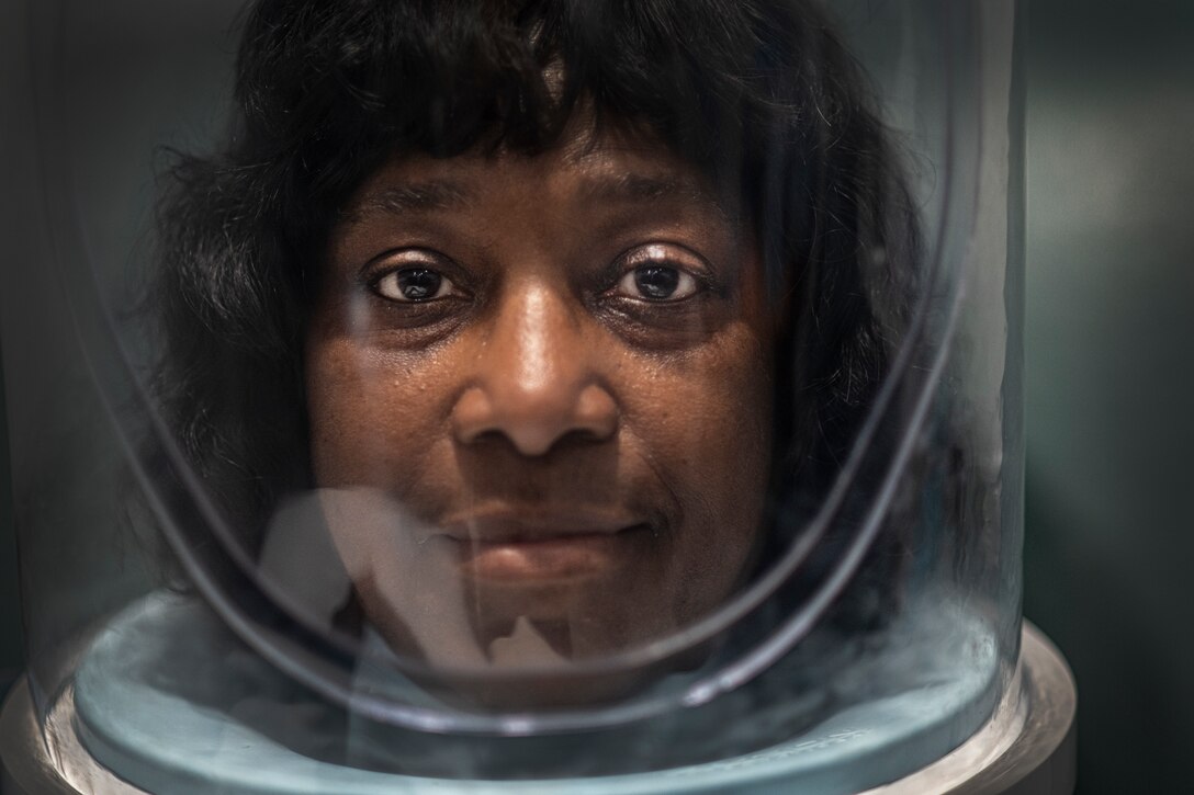 Gennette Jones, a hyperbaric patient, wears an oxygen hood inside a hyperbaric chamber at Brooke Army Medical Center May 31. Typical hyperbaric patients suffer from post-radiation injuries, decompression sickness, arterial gas embolism, chronic wounds, diabetics that have end-organ disease and poor circulation, sensory hearing loss, and burns.