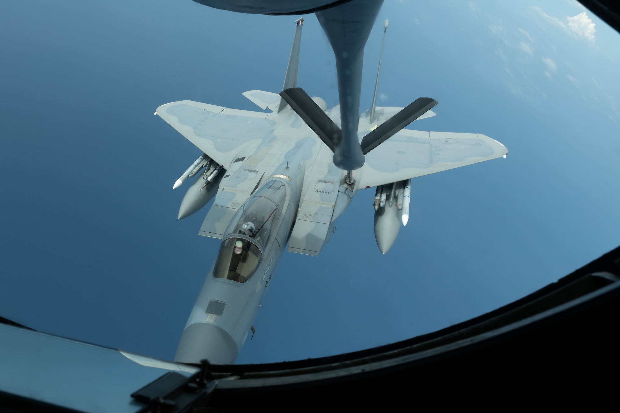 An F-15C Eagle from the 44th Fighter Squadron refuels with a KC-135 Stratotanker from the 909th Air Refueling Squadron July 10, 2019, during a training exercise out of Kadena Air Base, Japan. The 909th ARS helps ensure a free-and-open Indo-Pacific by providing air refueling to U.S., allies and partners within the area of responsibility. (U.S. Air Force photo by Airman 1st Class Matthew Seefeldt)