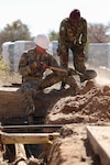 Spc. Adam Bates, with the North Carolina National Guard’s 882nd Engineer Company, shovels dirt from around water and sewer pipes while his Botswana Defense Force counterpart advises, in preparation for replacing a sewer line at Thebephatshwa Airbase in Botswana on July 11, 2019. This was one of several projects conducted in partnership with North Carolina, Alabama and New Jersey National Guards and the Botswanan Defense Force during Upward Minuteman 2019, a U.S. Africa Command exercise promoting the U.S. National Guard’s State Partnership Programs on the African Continent.