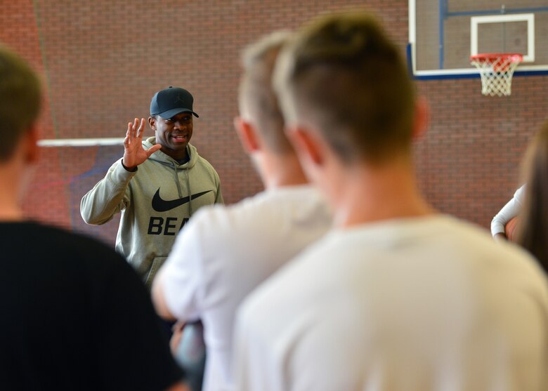 U.S. Air Force Tech. Sgt. Steven McCoy, 52nd Operations Group, Detachment 1 traffic manager and community outreach coordinator, introduces himself during a community outreach day near Powidz Air Base, Poland, July 13, 2019. McCoy led the outreach event and taught students the fundamentals of basketball. (U.S. Air Force photo by Staff Sgt. Jimmie D. Pike)