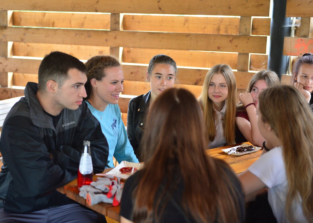 U.S. Airmen and students from Polish primary and secondary schools share their languages with each other near Powidz Air Base, Poland, July 13, 2019. The students, Airmen, and other community members participated in basketball, a road clean up, and a barbeque. (U.S. Air Force photo by Staff Sgt. Jimmie D. Pike)